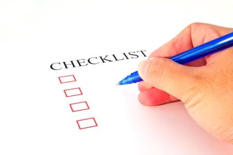 Checklist with pen and checked boxes. Stock Photos