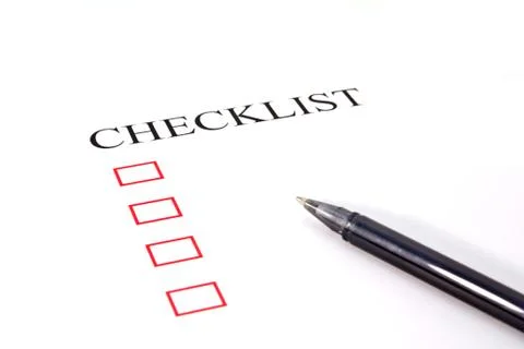 Checklist with pen and checked boxes. Stock Photos