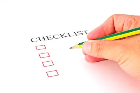 Checklist with pencil and checked boxes. Stock Photos