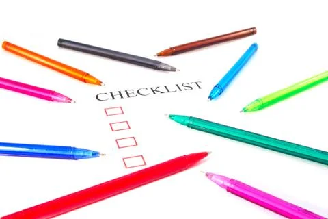 Checklist with pens and checked boxes. Stock Photos