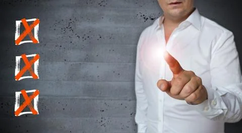 Checklist touchscreen is displayed by Man Stock Photos