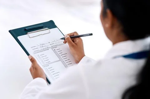 Checklist, woman doctor with clipboard and pen at the hospital. Check mark or Stock Photos