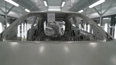 Checkman are checking assembling of car bodies before painting process. Car Stock Footage 163023158