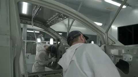 Checkman are checking assembling of cars before painting process. Car Stock Footage 163022306