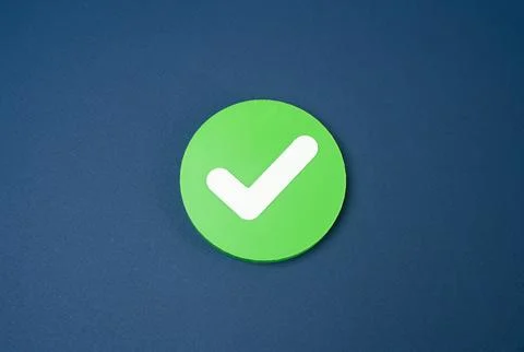 Checkmark in a green circle. Approval and completion status concept. Successf Stock Photos