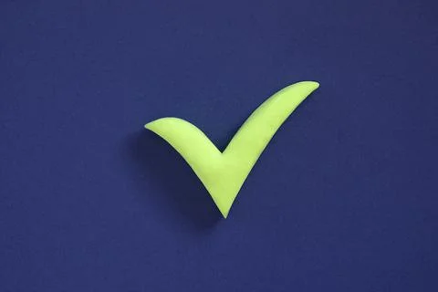 Checkmark sign on blue background. Concept of well done, confirmation or appr Stock Photos