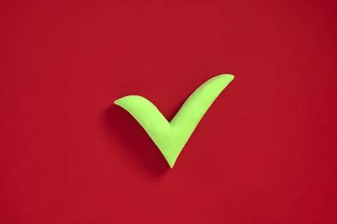 Checkmark sign on red background. Concept of well done, confirmation or appro Stock Photos