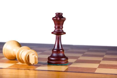 Checkmate white king lying in front of the white queen Stock Photos