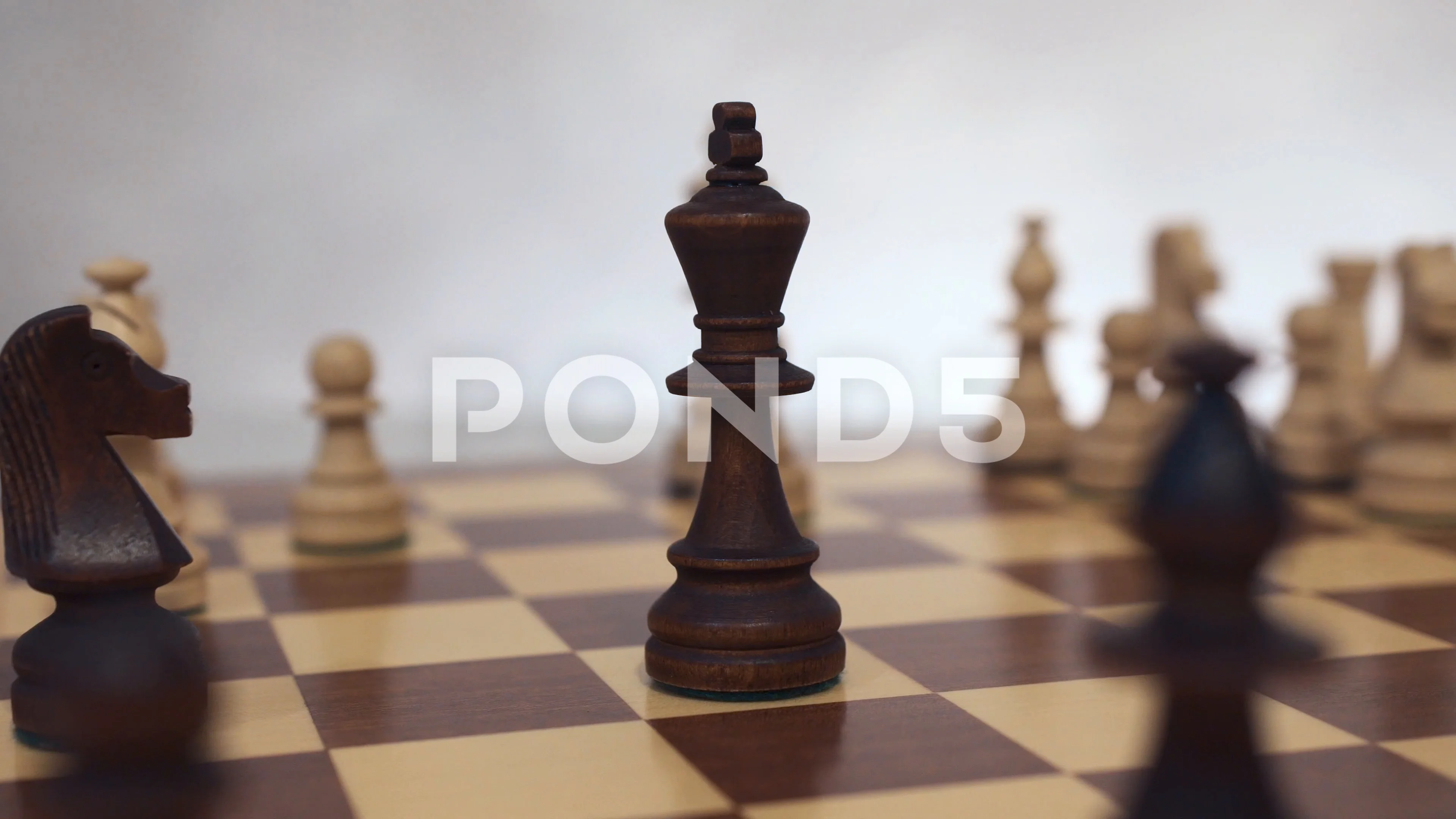 queen take a checkmate on chess board game. concept of business