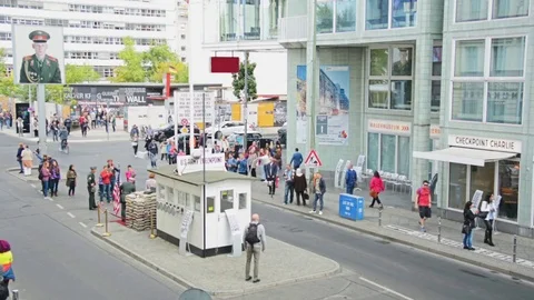 Checkpoint Charlie, an important Berlin Wall crossing point during the Cold War Stock Footage 85125546