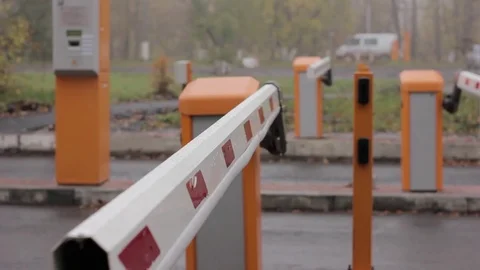 Checkpoint three posts. Automatic road barrier gate lifting gate opens and Stock Footage