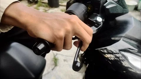 Checks The Brake Function of The Motorcycle Stock Footage 293028179