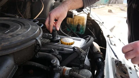 Checks the operation of the car engine Stock Footage 104424021