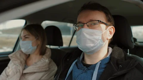 Checks temperature of driver and passenger before entering city Stock Footage 126950688