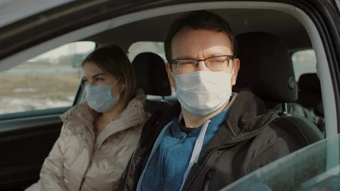 Checks temperature of driver and passenger before entering city Stock Footage 126950755