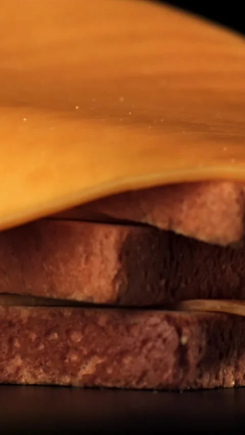 Cheddar cheese bread falls on the table. Filmed on a high-speed camera at 1000 Stock Footage 335377609