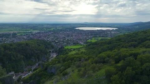 Cheddar Gorge and Caves from a drone, Cheddar, Somerset, England, Europe Video stock 248604247