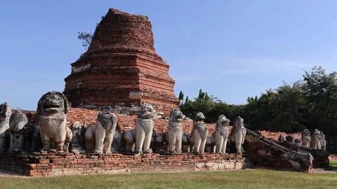 Chedi's Ruin Surrounded by Lion Statues of Wat Thammikarat Temple, Thailand Stock Footage 306314657