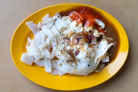 Chee Cheong Fun or Rice noodle roll served with sauces, and a sprinkle of sesame Stock Photos