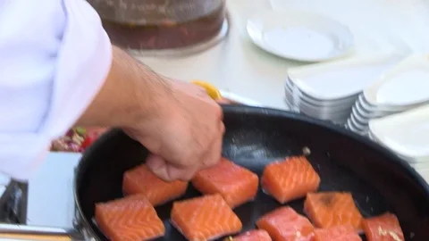 Cheef Prepares Salmon with Pine Nuts Stock Footage 92549253