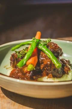 Cheeky Git Braised beef cheek stew with french beans and housemade mash Foto stock