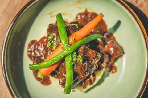 Cheeky Git Braised beef cheek stew with french beans and housemade mash 写真素材