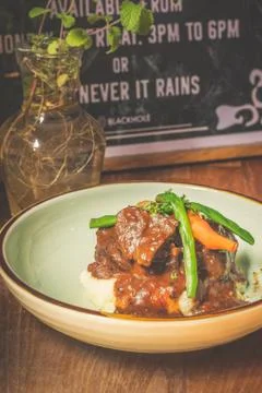 Cheeky Git Braised beef cheek stew with french beans and housemade mash Stock Photos