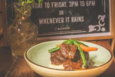Cheeky Git Braised beef cheek stew with french beans and housemade mash 写真素材