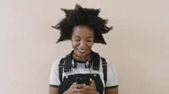 Cheerful African American Woman Portrait Of Trendy Young Woman Using Smartphone Stock Footage