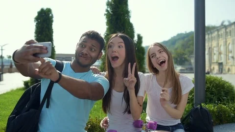 Cheerful and optimistic friends taking selfies Stock Footage 79470684