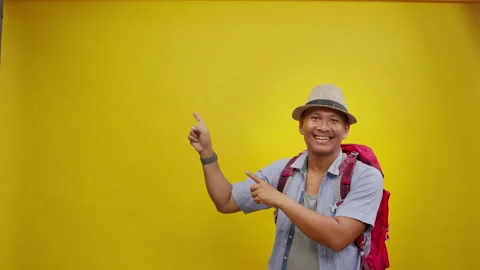 Cheerful Backpacker Pointing Toward Empty Copy Space Stock Footage 336994916