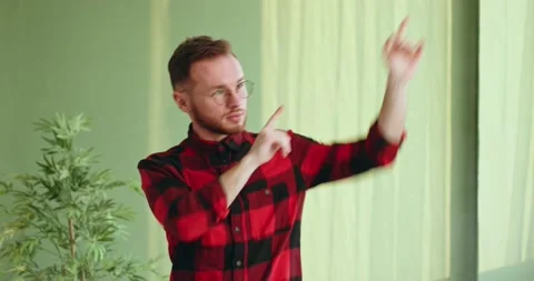 Cheerful bearded man dancing and pointing at camera Stock Footage 155118261