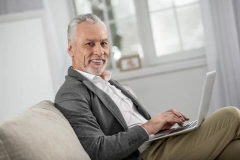Cheerful bearded man posing on camera Stock Photos