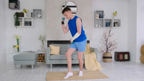 Cheerful beginner athlete dancing at home doing fitness Stock Footage 128581245