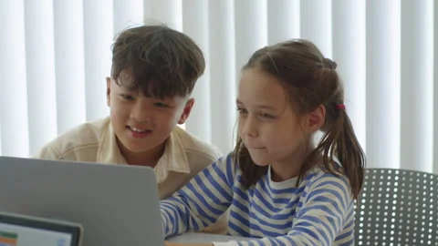 Cheerful Biracial Kids Coding on Laptop at Computer Class Video stock 280537118