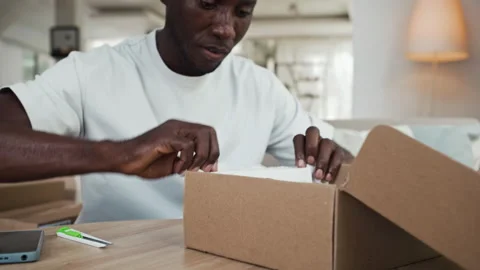 Cheerful Black Man Being Glad about Getting New Pair of Shoes as Parcel Video stock 281710342
