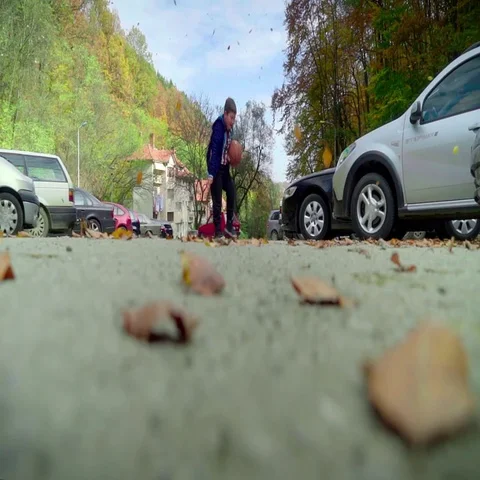Cheerful boy chasing yellow leaves. Autumn. Stock Footage 69322909