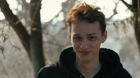 Cheerful boy laughing to the camera in the forest 動画素材 105080209