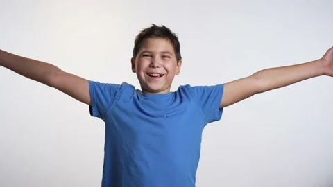 Cheerful boy with raised hands Video stock 239623993