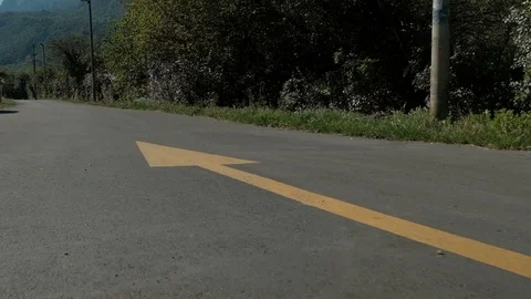 Cheerful boy running along the path along the drawn arrow Stock Footage 74527224