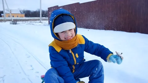 Cheerful boy sledding in the winter 스톡 동영상 45679403