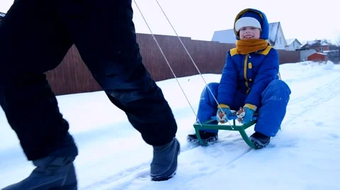 Cheerful boy sledding in the winter Stock Footage 45679541