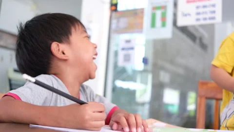 Cheerful boy study lesson and laughing Stock Footage 163952951