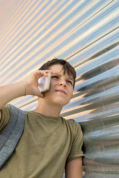 Cheerful boy using a mobile phone Stock Photos