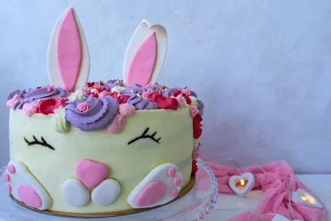 Cheerful bunny cake for Easter and Birthday. Greeting card. Modern concept de Stock Photos