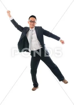 Cheerful businessman dancing in success over a white background Stock Photos