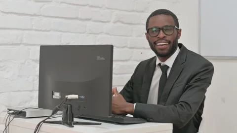 Cheerful Businessman Smiling While Working on Computer Stock Footage 310170061