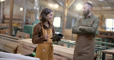 Cheerful carpentry workers at the manufacturing Stock Footage 146918053