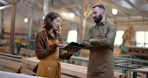 Cheerful carpentry workers at the manufacturing Stock Footage 146918767