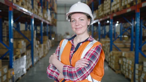 Cheerful Caucasian worker smiling looking at camera in a warehouse Stock-Footage 164238087